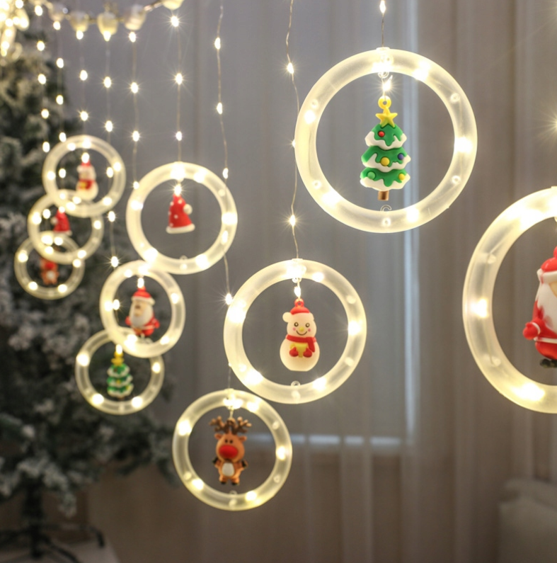 Kalėdinės užuolaidinės LED lemputės su vitražiniais personažais – Kalėdų Senelis, sniego seniai ir eglutės (108 LED, 3 m)